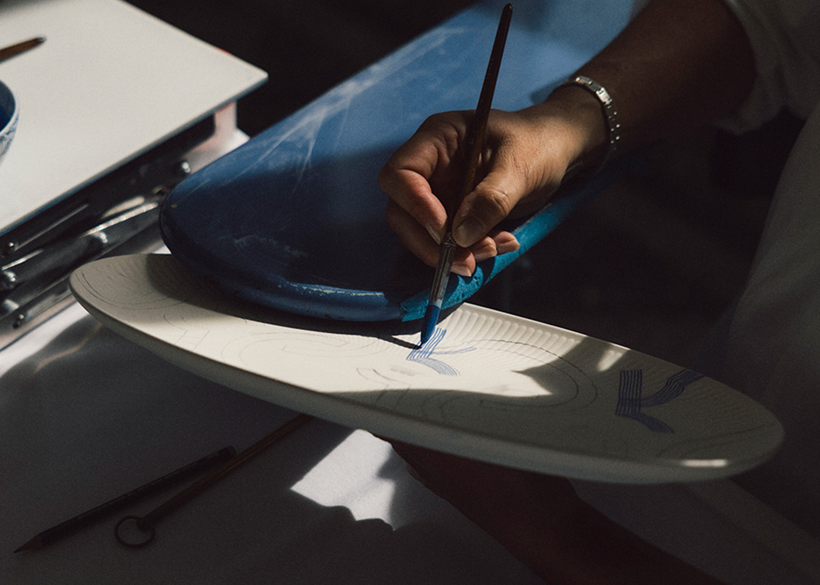 One of our skilled painters painting MOTIF